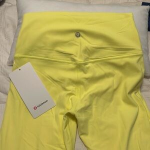 Bright yellow lined Lulu leggings 21’ crop.